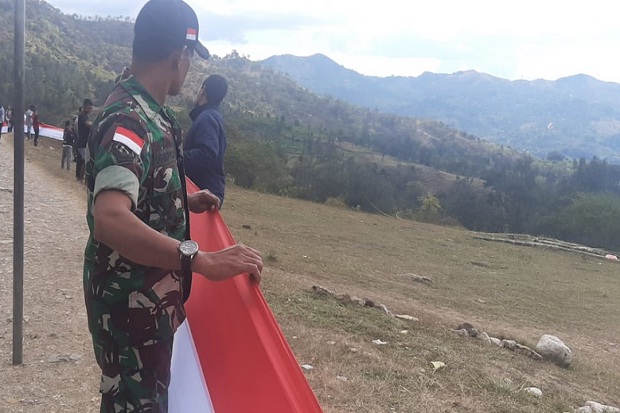 Satgas Yonmek 741 Bentangkan Merah Putih Sepanjang 1.773 Meter